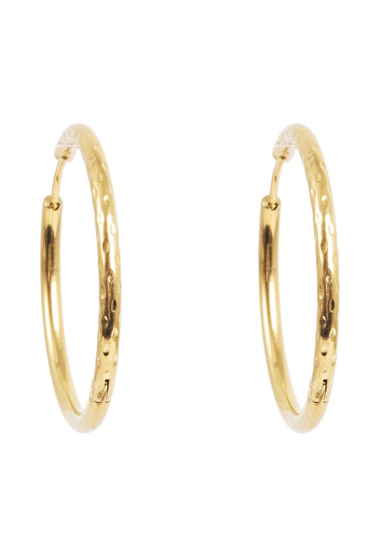 Gold hoop earrings on a white background