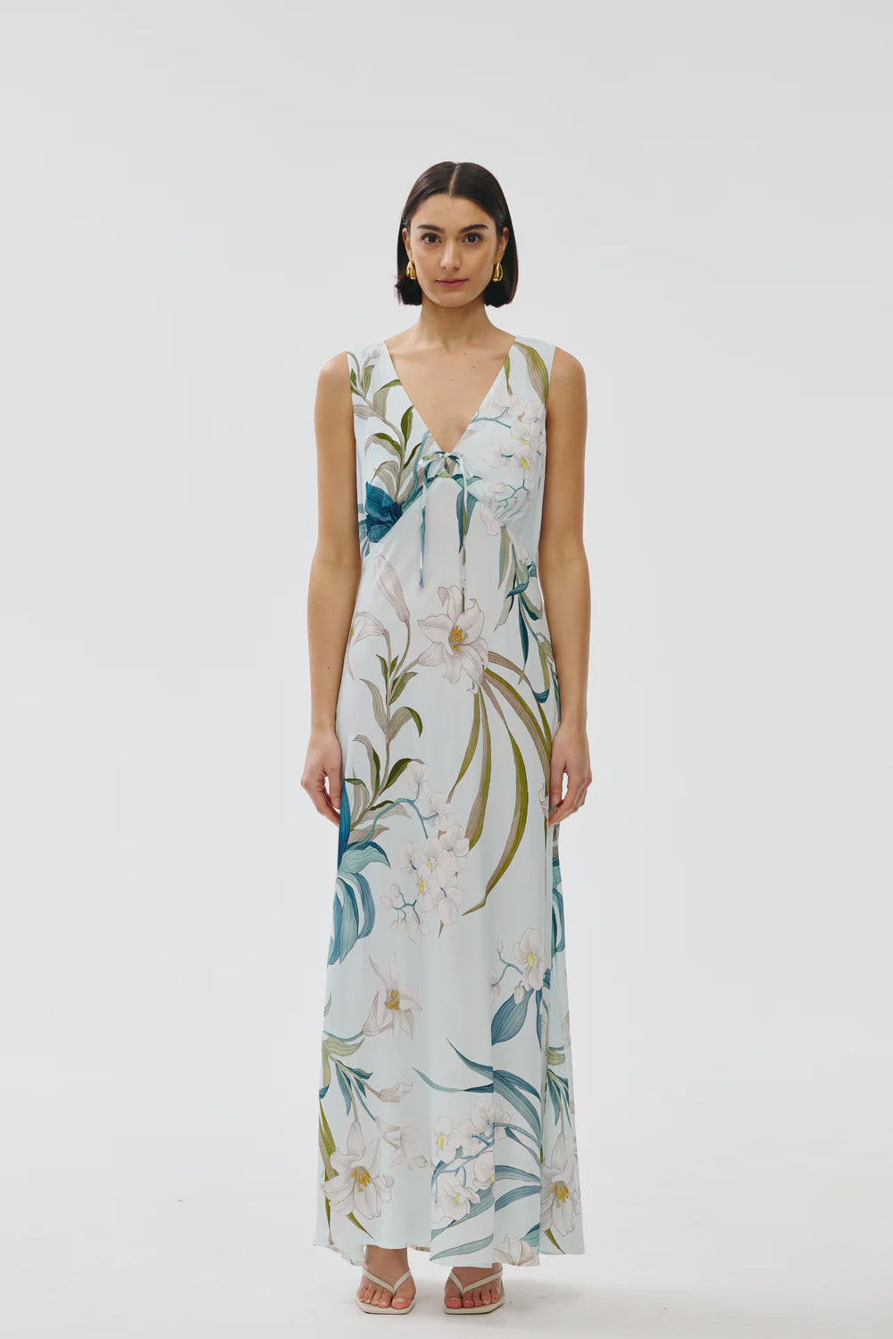 Woman wearing a floral dress on a white background