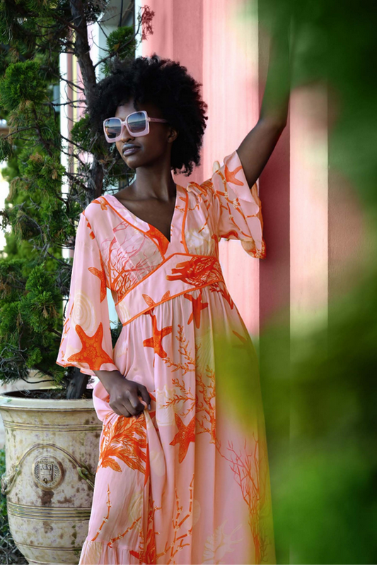 Woman wearing a floral dress with a blurred background